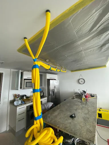 Drying equipment working on a water-damaged ceiling